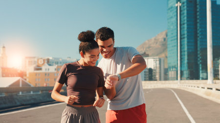 Happy team, fitness and checking watch with performance tracker for workout results in city street. Man, woman or runners with smile or wristwatch for health, calories or exercise goals in urban townの写真素材