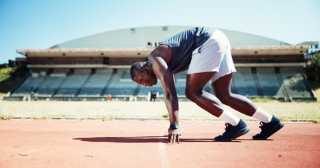 Start, competition and sports with black man on race track for fitness, training and cardio...