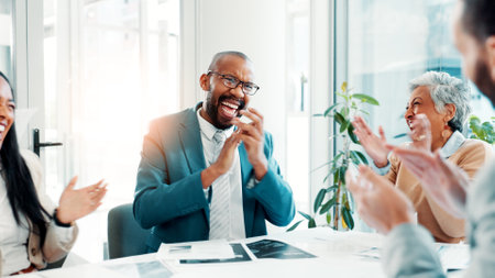 Business people, excited and team clapping in office for success, celebrate or laugh for financial profit. Group applause, cheers and achievement of goal, excellence or well done with investment dealの写真素材