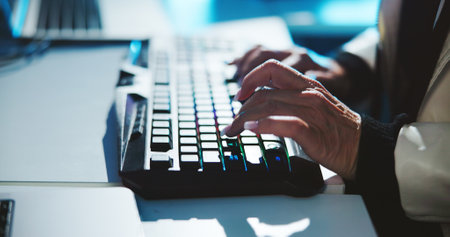 Woman, hands and typing with keyboard for research, email or communication at office. Closeup of female person, journalist or business writer working late on computer for content creation at nightの写真素材