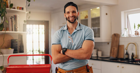 Plumber, arms crossed and portrait of man in kitchen for maintenance, house renovation and drainage...