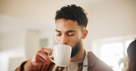 Man, chef and drinking coffee in kitchen for morning beverage, break or caffeine at home. Male...