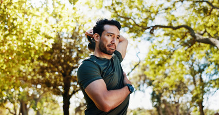 Fitness, outdoor and man workout with kettlebell for tricep extension, health or intense exercise for wellness. Bodybuilder, strength training and weightlifting for muscle growth, power and strongの写真素材