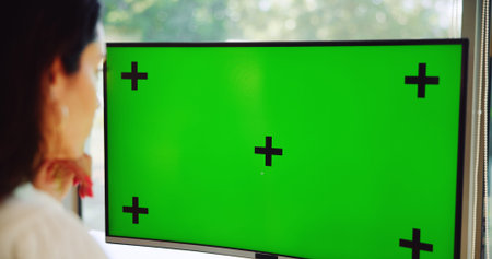 Computer, green screen and businesswoman in office for research with stock market information....