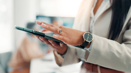 Business, hands and tablet with person in office for corporate research or online planning. App, development and information with employee in professional workplace to connect or scroll for updateの写真素材