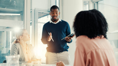 Presentation, talking or business people in meeting, tablet and feedback for budget report. Group, employees or financial agency in office, tech or speaker with training, digital app or collaborationの写真素材