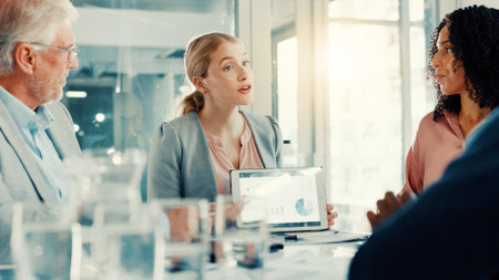 Presentation, business woman and tablet screen with charts in meeting, investment stats or planning. Office, team and brainstorming with technology for financial data, analysis and kpi on dashboardの写真素材