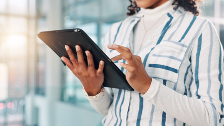 Hands, woman and typing on tablet in office for research, financial report and schedule update....