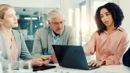 Boardroom, collaboration and woman with laptop, discussion and investment idea on website or online. Corporate, financial analyst and people with tech for opportunity, talking or research for meetingの写真素材
