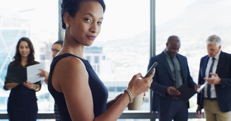 Office, businesswoman or lawyer in portrait with phone, corporate career or legal aid to contact. Consultant, female person or attorney with mobile for law firm, case email or smile with coffee drinkの写真素材