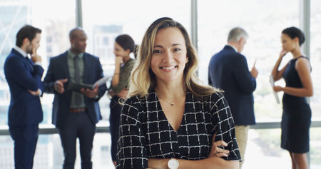 Office, businesswoman and lawyer in portrait with pride, corporate career or legal aid with smile. Confident, female attorney or leadership with arms crossed for about us, justice or case at law firmの写真素材