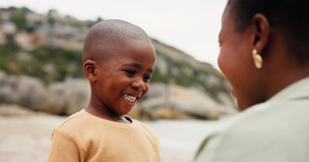 Happy, black family and child with mom on beach for vacation, holiday or weekend in nature. Kid, son...