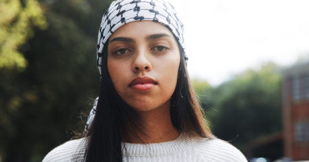 Portrait, woman and keffiyeh scarf in city for islamic culture, Eid Mubarak and national identity....