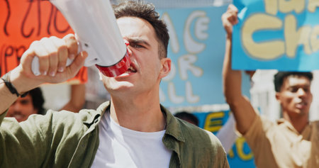 Angry, shouting or man with bullhorn in protest for announcement, human rights or fight. People,...