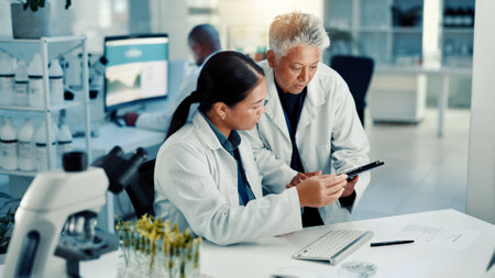 Science, team and discussion on tablet in lab for medical research, vaccine report and experiment. Scientist, people and digital app for pharmaceutical development, biotechnology study and innovationの写真素材