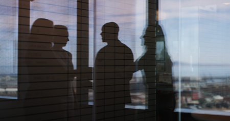 Discussion, window reflection and business people in office with partnership for finance report....