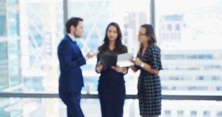 Office, paperwork and meeting with business people for partnership, discussion or agenda. Document, proposal and B2B contract with team blur for feedback, corporate review and networking or workshopの写真素材