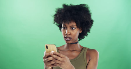 Phone, shock and text message with black woman in studio for communication of bad news or update....