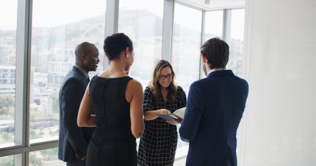 Meeting, briefing and business people with manager in office for corporate budget feedback. Discussion, paperwork and team of financial advisors with mentor for investment planning in workplace.の写真素材