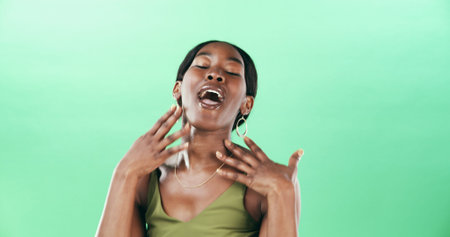 Music, singing and voice of black woman on green background for performance or talent show. Artist,...