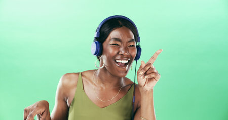 Excited, dancer and headphones with black woman in studio for streaming, audio playlist and music....