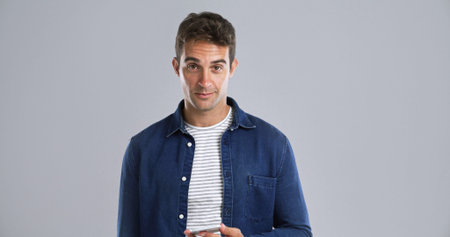 Portrait, phone and man in studio for social media, text or message on white background space....