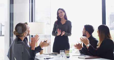 Colleagues, applause and praise for speaker, boardroom and woman with smile for proposal or success....