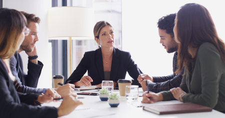 Collaboration, feedback and meeting with business people in boardroom of discussion or planning. Corporate, report and teamwork with employee group in office together for professional workshopの写真素材