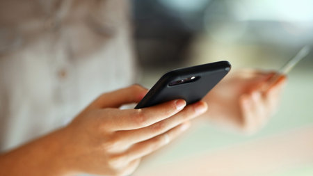 Person, hands or phone with credit card for online shopping, payment or banking app in city....