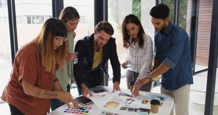 Office, business people and teamwork with choice for color swatch, creative agency and planning. Boardroom, women or men as graphic designer with palette for brainstorming, company branding or pointの写真素材