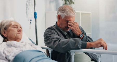 Senior couple, sick and stress by hospital bed for cancer diagnosis, tired or headache. Disease, sad...