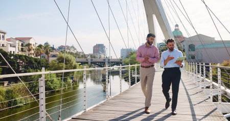 Tablet, walk and business men in city with company planning, collaboration and budget discussion....