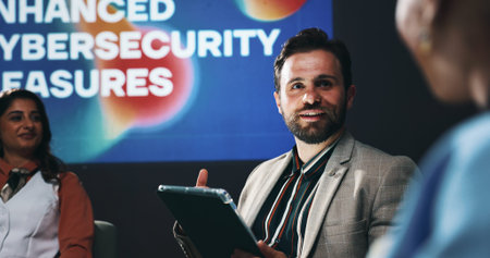 Tablet, seminar and business people on a stage for forum on enhanced cybersecurity measures....
