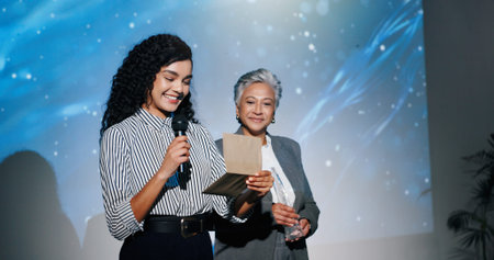Announcement, awards ceremony and presentation with business women on stage for corporate event....