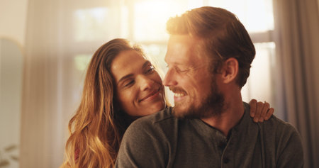 Smile, couple and embrace in home for care, love and security with partner. Happy man, woman and...