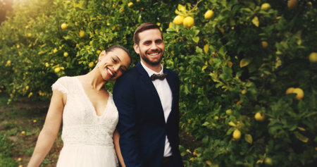 Wedding, portrait and couple with smile for outdoor, marriage event and celebration together. Partnership, commitment and trust of bride, groom and excited for romance and love in relationshipの写真素材