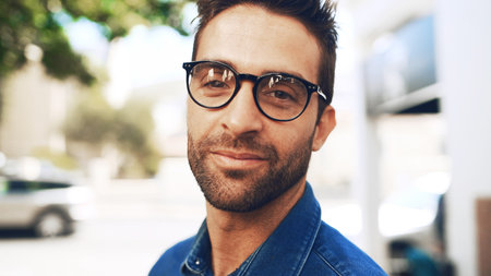 Glasses, portrait and business man in city with environmental journalist on commute. Face, confidence and professional worker outdoor, creative employee and reporter for eco friendly news in Franceの写真素材