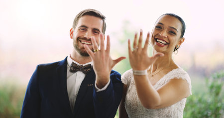 Hands, wedding rings and portrait of couple with marriage, bonding and connection together at event....