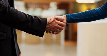 Handshake, offer and business people in office with agreement, welcome or negotiation with finance. Partnership, greeting and financial manager shaking hands with investor for investment deal.の写真素材