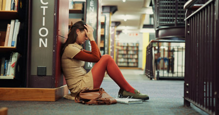 Student, university or girl with stress in library for learning pressure, test fail or overwhelmed....