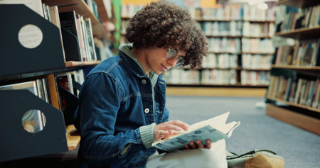 Glasses, student and reading book in library for education, research and knowledge in university....