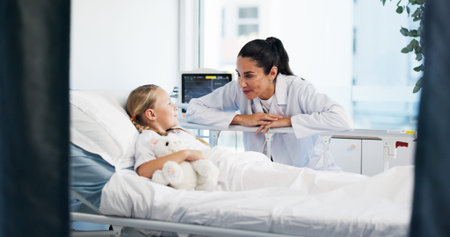 Healthcare, doctor and kid in bed for recovery, treatment update and teddy bear for comfort. Girl...