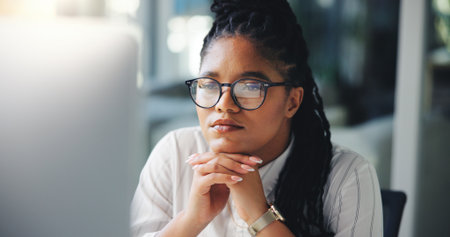 Reading, thinking and computer with business black woman for legal research, case news and idea. Client feedback, reflection and attorney review with person for lawyer report and online updateの写真素材