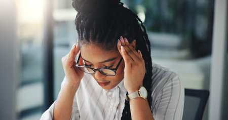 Stress, black woman and headache with glasses at office for burnout, fatigue or overworked. Female...