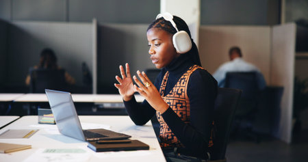 Headphones, laptop and video call with business black woman in office for learning online. Computer,...
