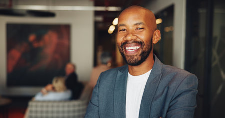 Business, portrait and smile of black man in lobby of convention center for conference or seminar. Development, tradeshow and workshop with happy employee waiting in foyer of corporate workplaceの写真素材