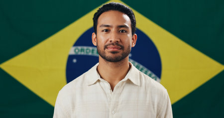 Brazil, flag and man with pride for country, holiday or symbol for citizenship, voter and portrait. Political, person and representative for nation, confident and support for patriotism and identityの写真素材