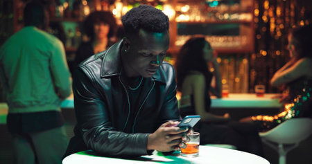 Phone, online dating and waiting with man in nightclub for relationship app, communication and...