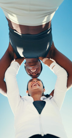 Huddle, running and teamwork with friends in city for support, fitness club and motivation. Sports challenge, exercise and connection with low angle of people for wellness, training and marathonの写真素材