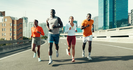 Fitness, group and people running in city with workout, health or training for marathon. Sports,...